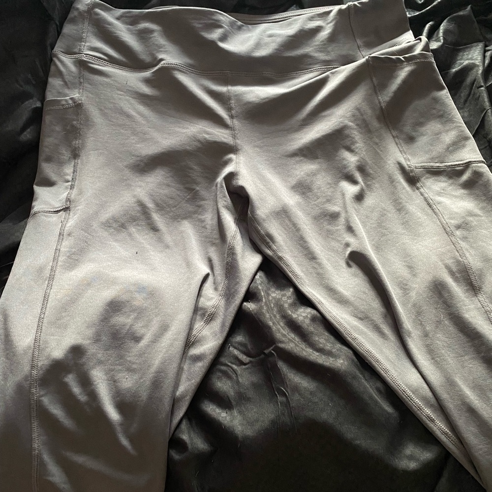 Grey aerobic workout pants with side pockets